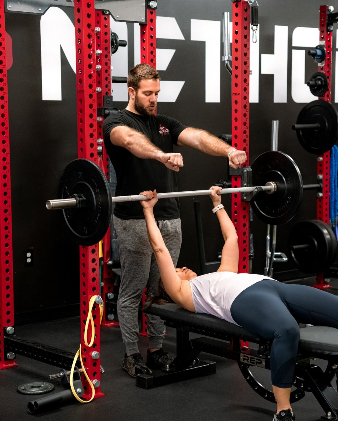 TJ spotting a bench press