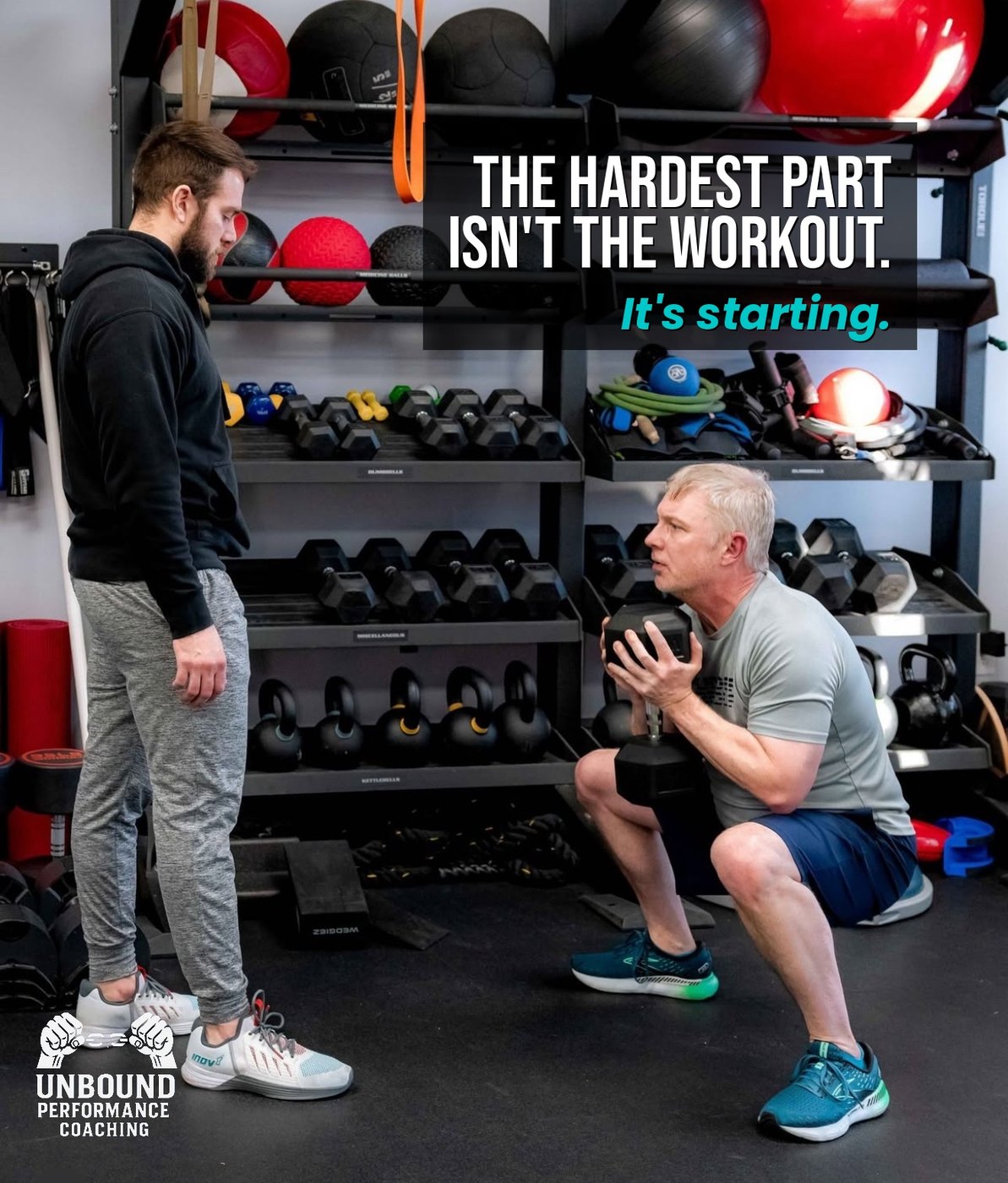 TJ coaching a dumbbell squat